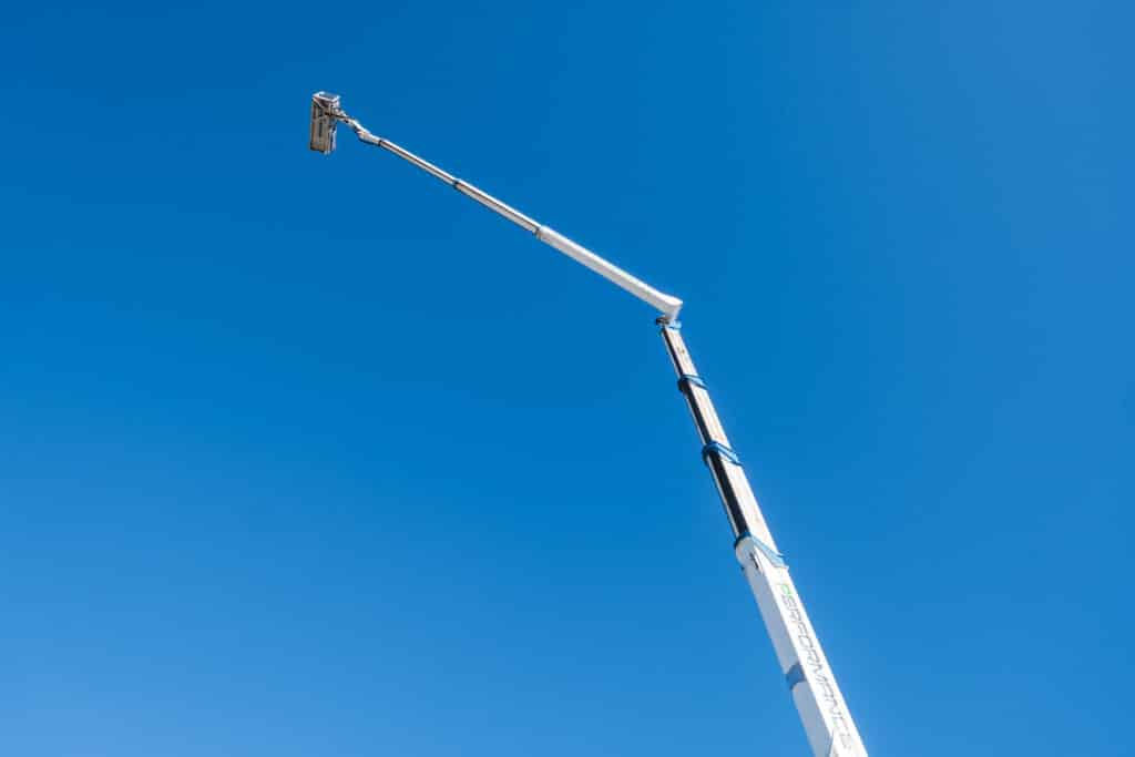 tall cherry picker reaching into the sky